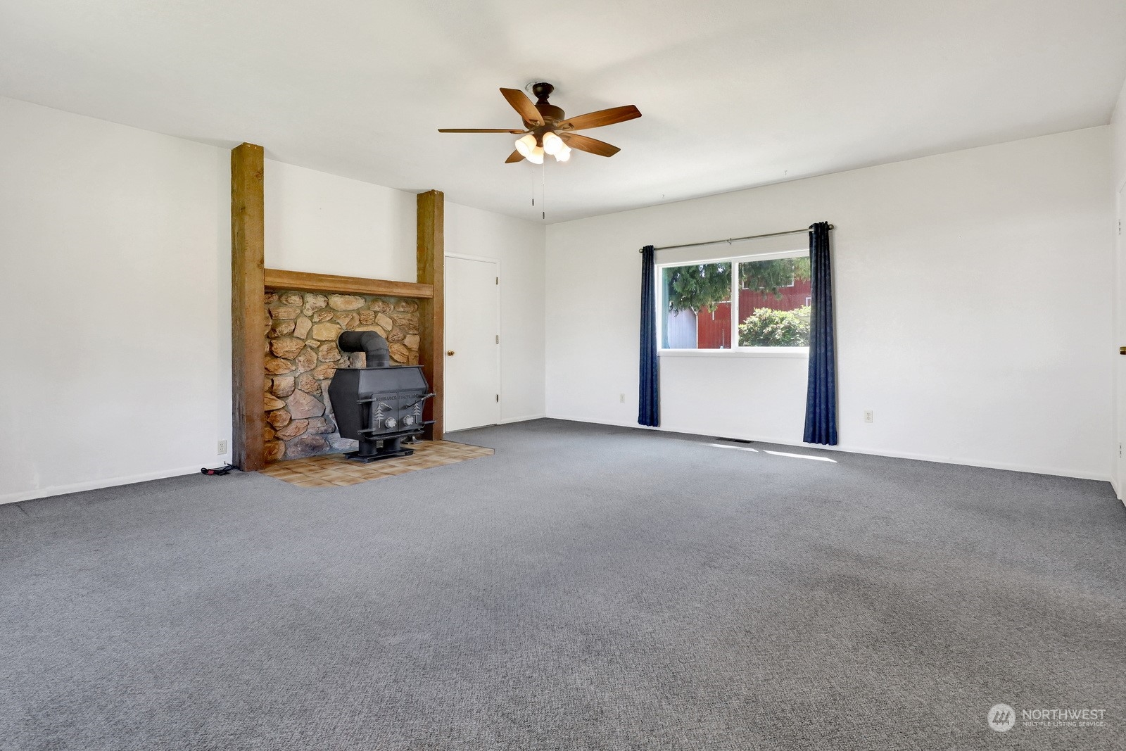 1705 Pangborn Road Lynden, WA 98264 - Photo 12 of 40 a view of a livingroom with a ceiling fan and a window