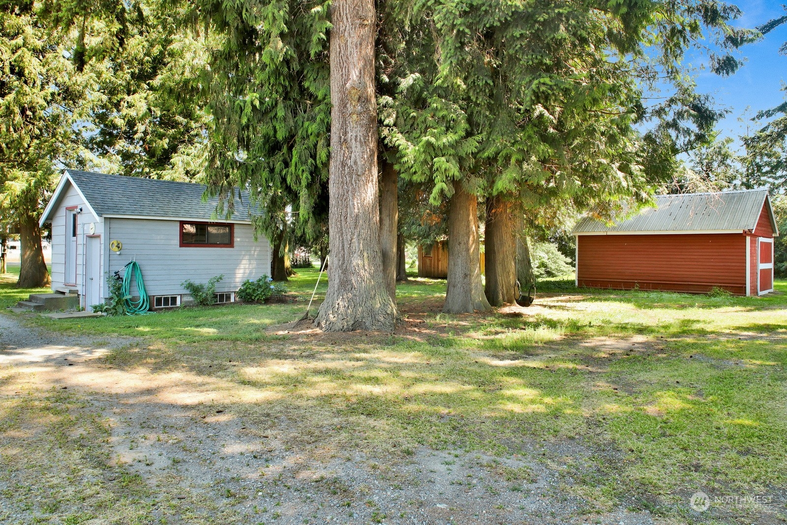 1705 Pangborn Road Lynden, WA 98264 - Photo 30 of 40 a backyard of a house with table and chairs