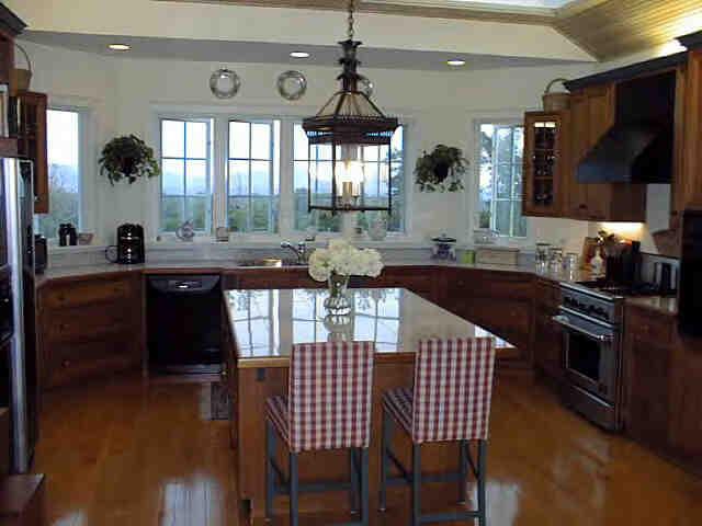 165 Perry Peak Road Richmond, MA 01254 - Photo 2 of 7 a kitchen with stainless steel appliances granite countertop a sink a stove a table and chairs