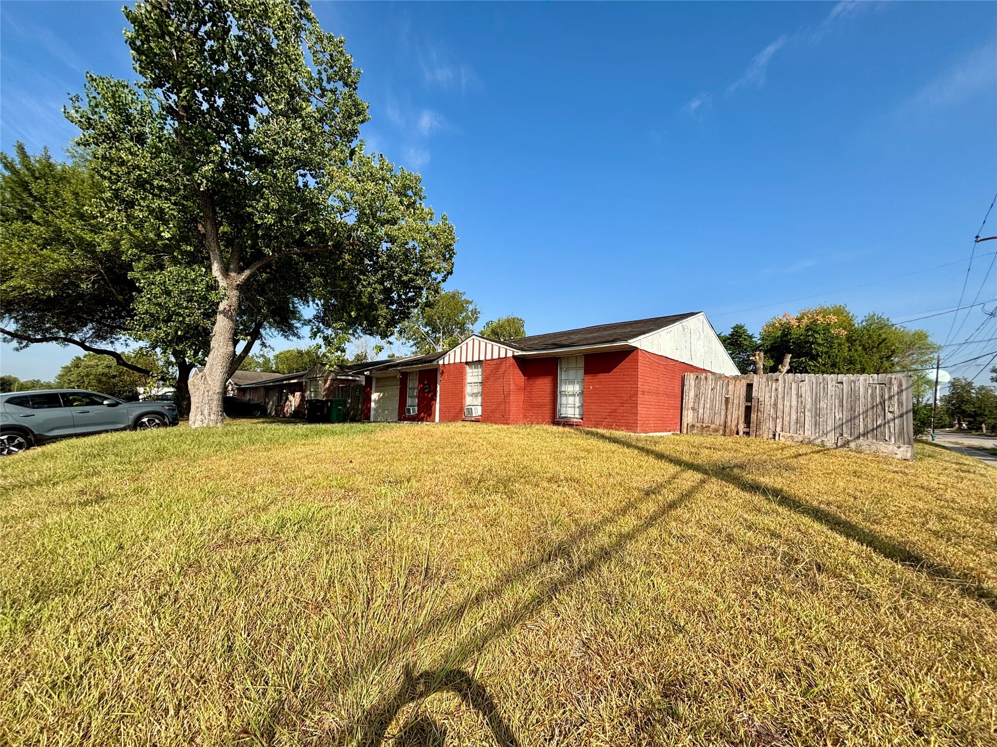 3902 Heatherbloom Drive Houston, TX 77045 - Photo 1 of 22 a front view of a house with a yard