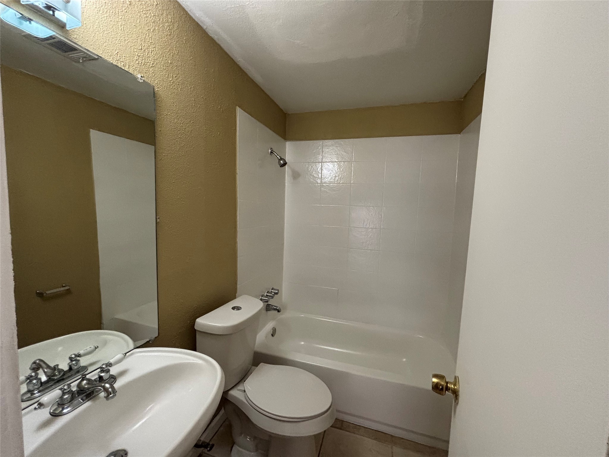 3902 Heatherbloom Drive Houston, TX 77045 - Photo 11 of 22 a bathroom with a sink toilet and shower