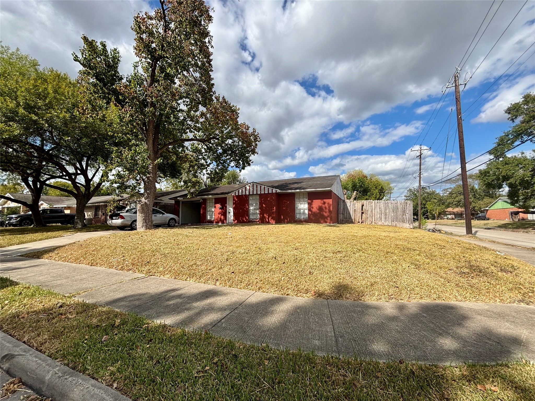 3902 Heatherbloom Drive Houston, TX 77045 - Photo 22 of 22 a front view of house with yard and trees