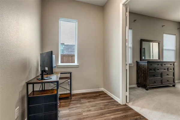 a room with furniture and wooden floor