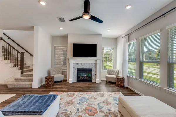 a living room with furniture and a fireplace