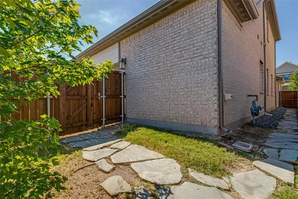 a view of a backyard with a tree