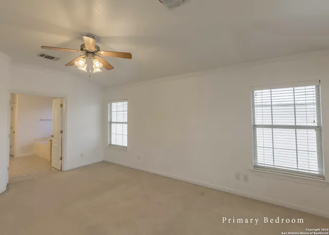a bathroom with a double vanity sink a toilet and shower