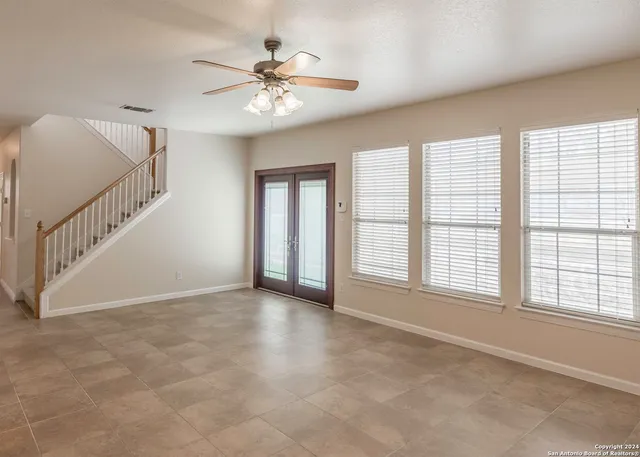 a white toilet sitting next to a bathroom sink