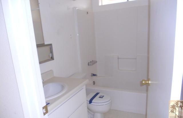 6117 Panorama Road Joshua Tree, CA 92252 - Photo 5 of 6 a bath room with a toilet and a bath tub