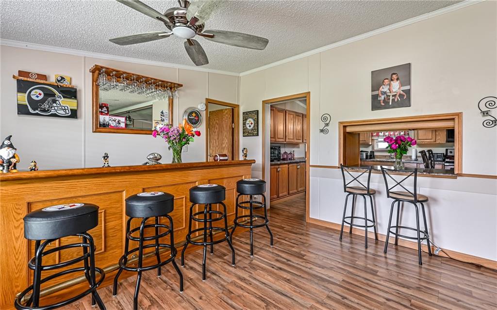 307 Hungarian Road Slippery Rock, PA 16057 - Photo 7 of 34 a view of a dining room with furniture and wooden floor