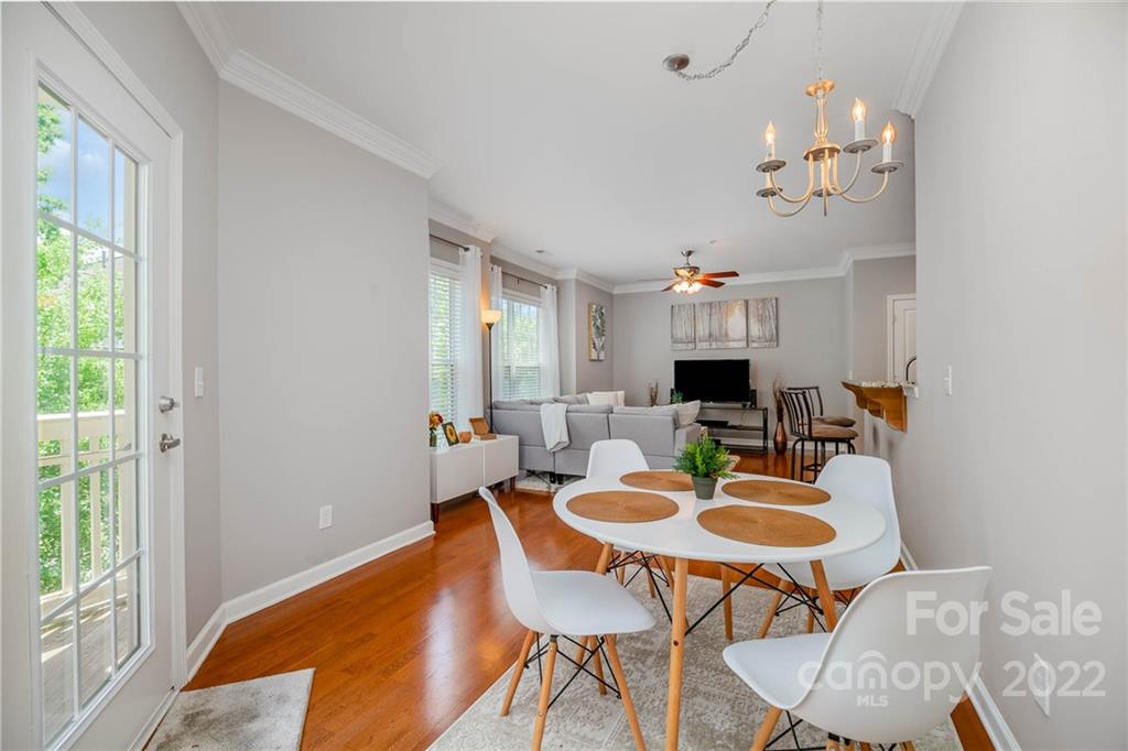 4156 Walker Road Charlotte, NC 28211 - Photo 5 of 24 a view of a dining room with furniture window and wooden floor