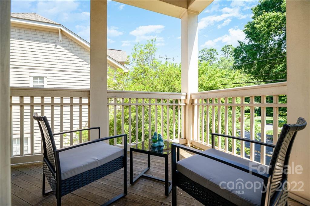 4156 Walker Road Charlotte, NC 28211 - Photo 7 of 24 a city view from a balcony with chairs