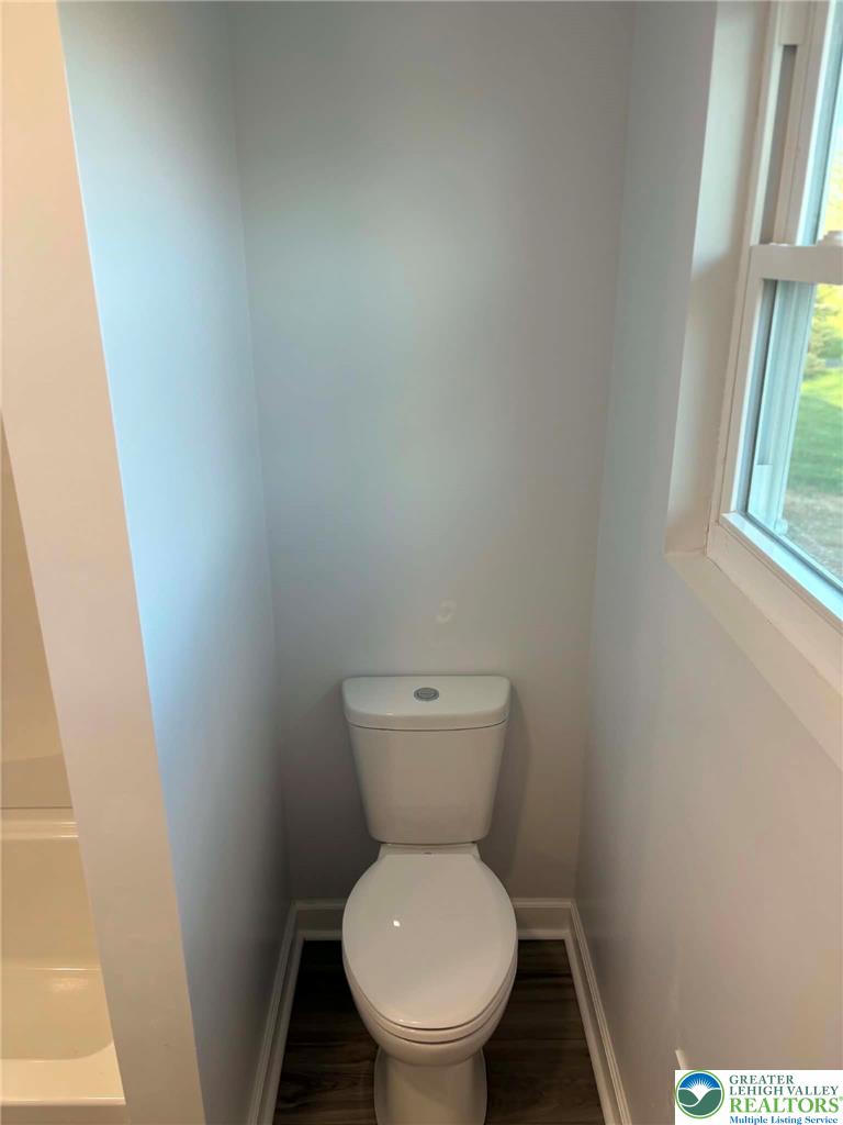 3957 Mountain Road Slatington, PA 18080 - Photo 20 of 33 a white toilet sitting in a bathroom next to a window