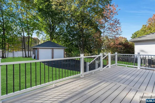 a view of house with a deck