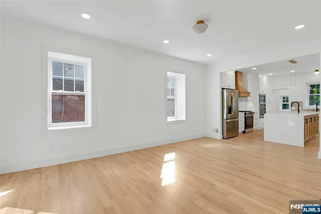 a view of kitchen with cabinets and wooden floor