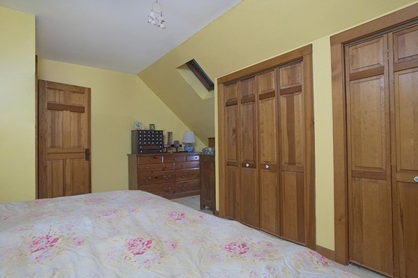 1325 Bay Road Amherst, MA 01002 - Photo 25 of 30 a bedroom with a bed and a chandelier