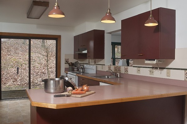 1325 Bay Road Amherst, MA 01002 - Photo 7 of 30 a kitchen with a sink a counter space and dining table
