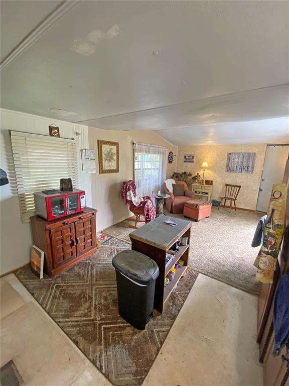 148 Swan Lake Road Melrose, FL 32666 - Photo 11 of 30 a living room with furniture and a wooden floor
