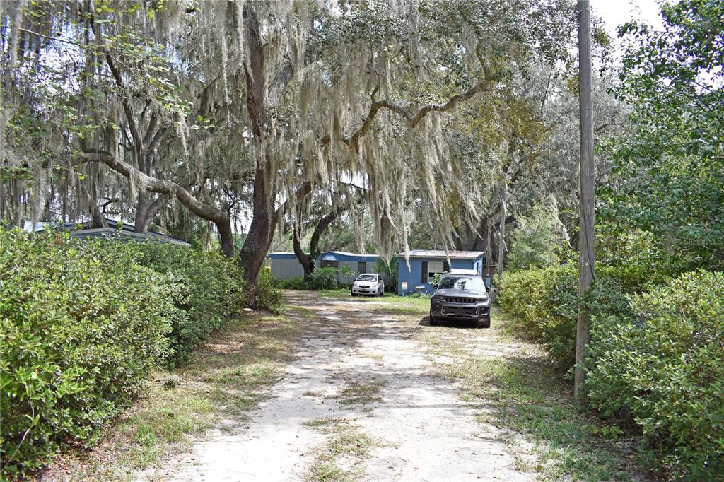 148 Swan Lake Road Melrose, FL 32666 - Photo 2 of 30 a front view of a house with a garden