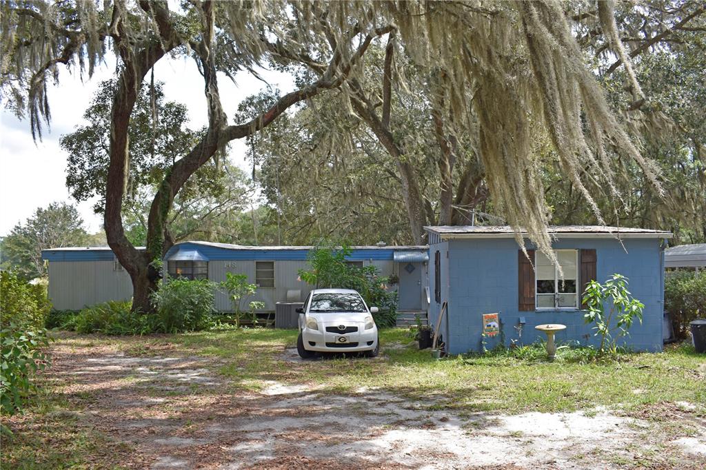 148 Swan Lake Road Melrose, FL 32666 - Photo 4 of 30 a car parked in front of a house