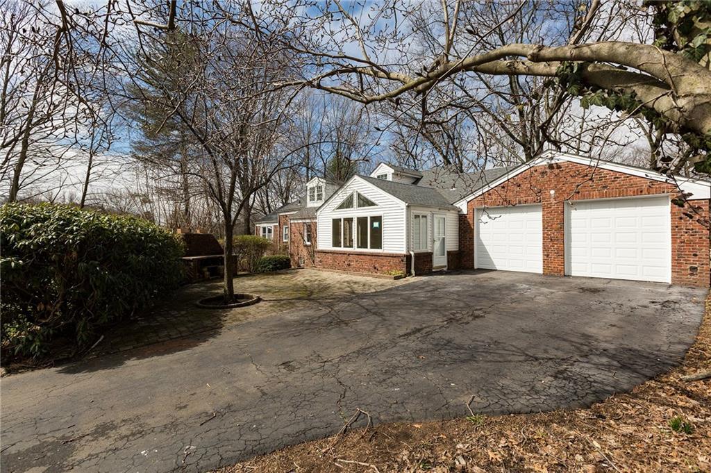 36 Ford Street Hamden, CT 06517 - Photo 1 of 1 a front view of a house with a yard and garage