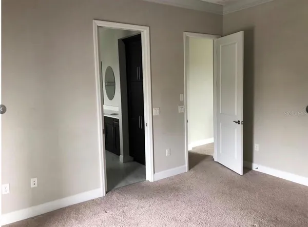 a view of an empty room and closet