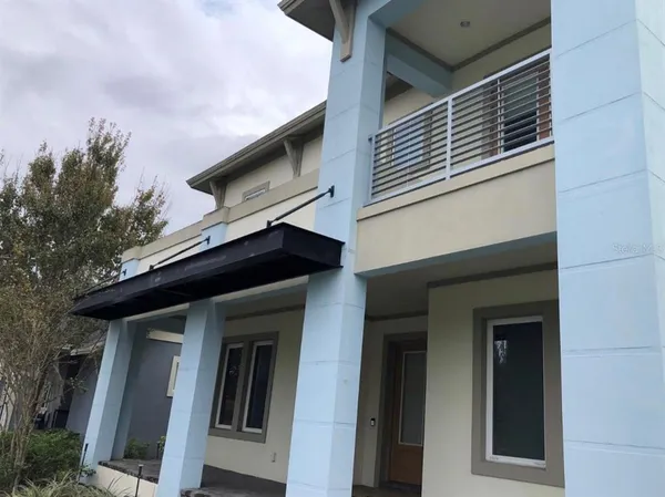 a front view of a house with a space balcony