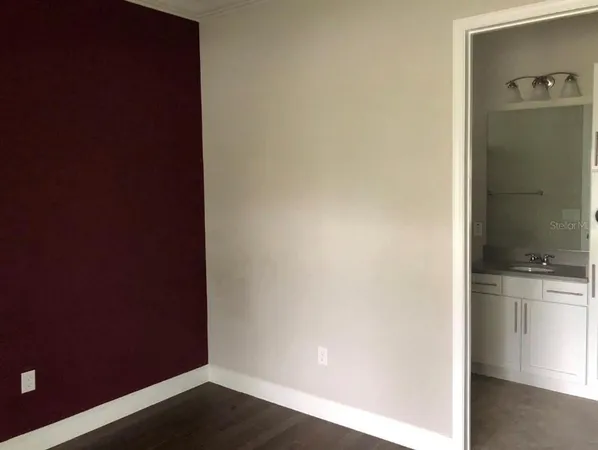 a view of a kitchen from the hallway