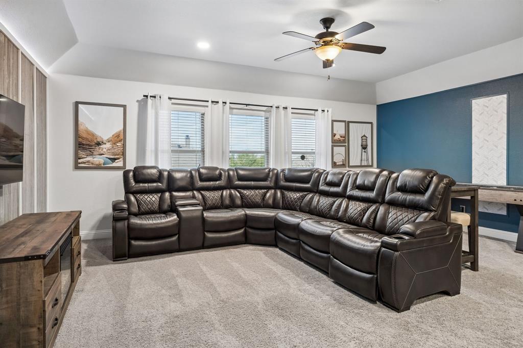 3917 Gatewick Drive Rockwall, TX 75087 - Photo 24 of 34 a living room with furniture ceiling fan and a window