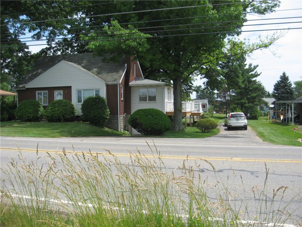 HOME OFFERS SECOND DRIVEWAY WITH EXTRA CARPORT AND ADDED PARKING.