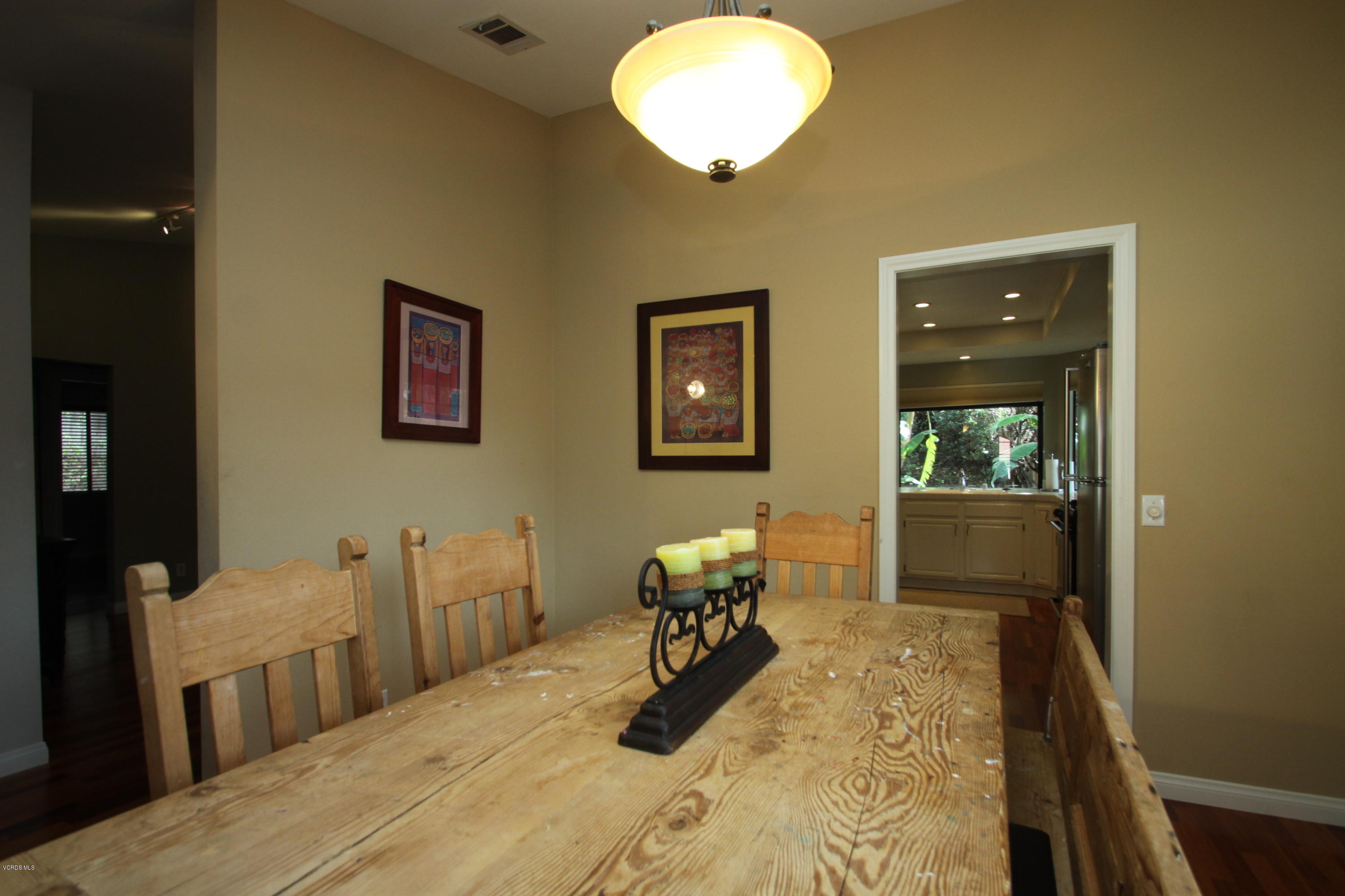 13638 Bear Valley Road Moorpark, CA 93021 - Photo 11 of 18 a bedroom with bed and wooden floor