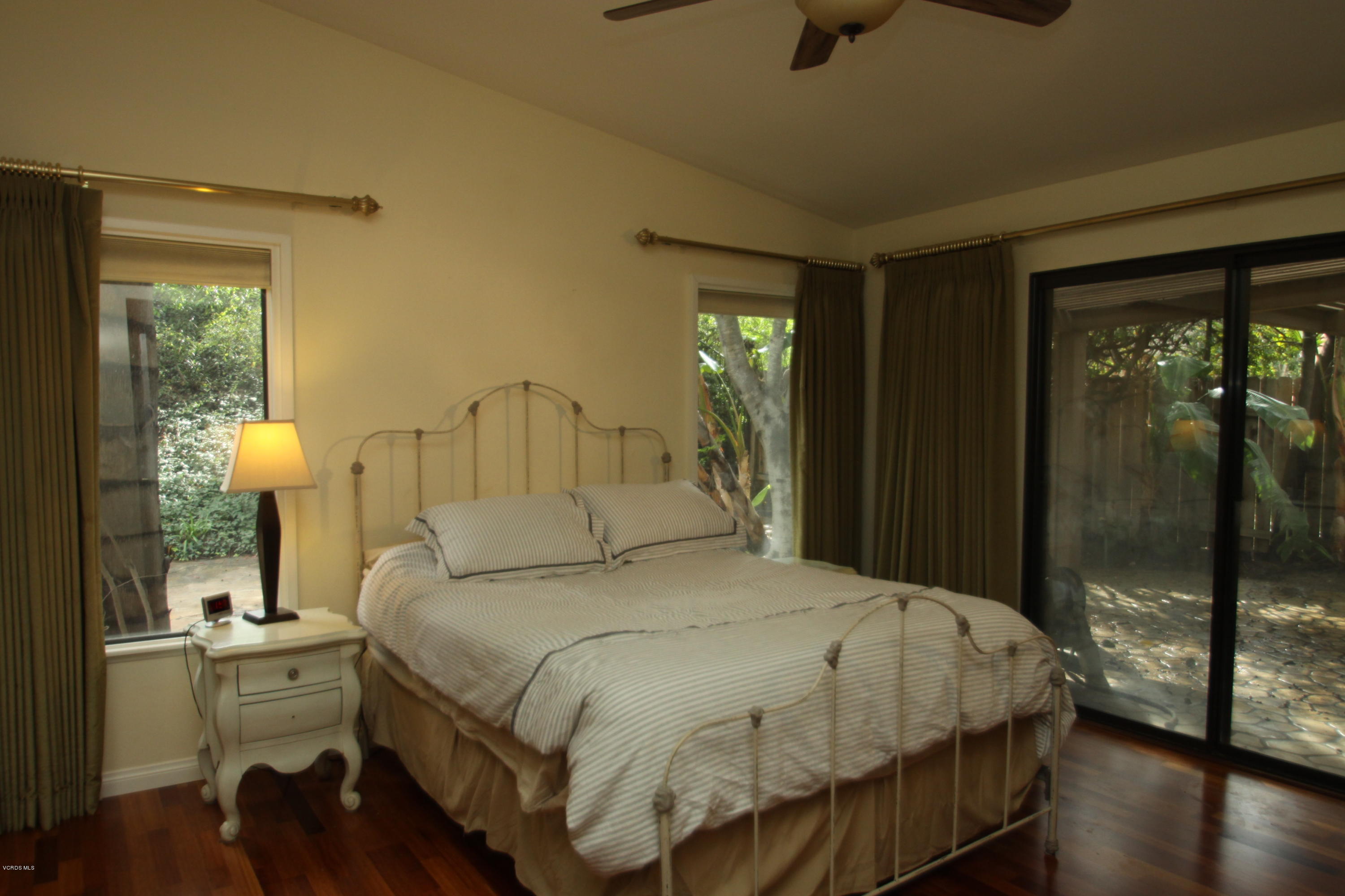 13638 Bear Valley Road Moorpark, CA 93021 - Photo 14 of 18 a bedroom with a bed and a window