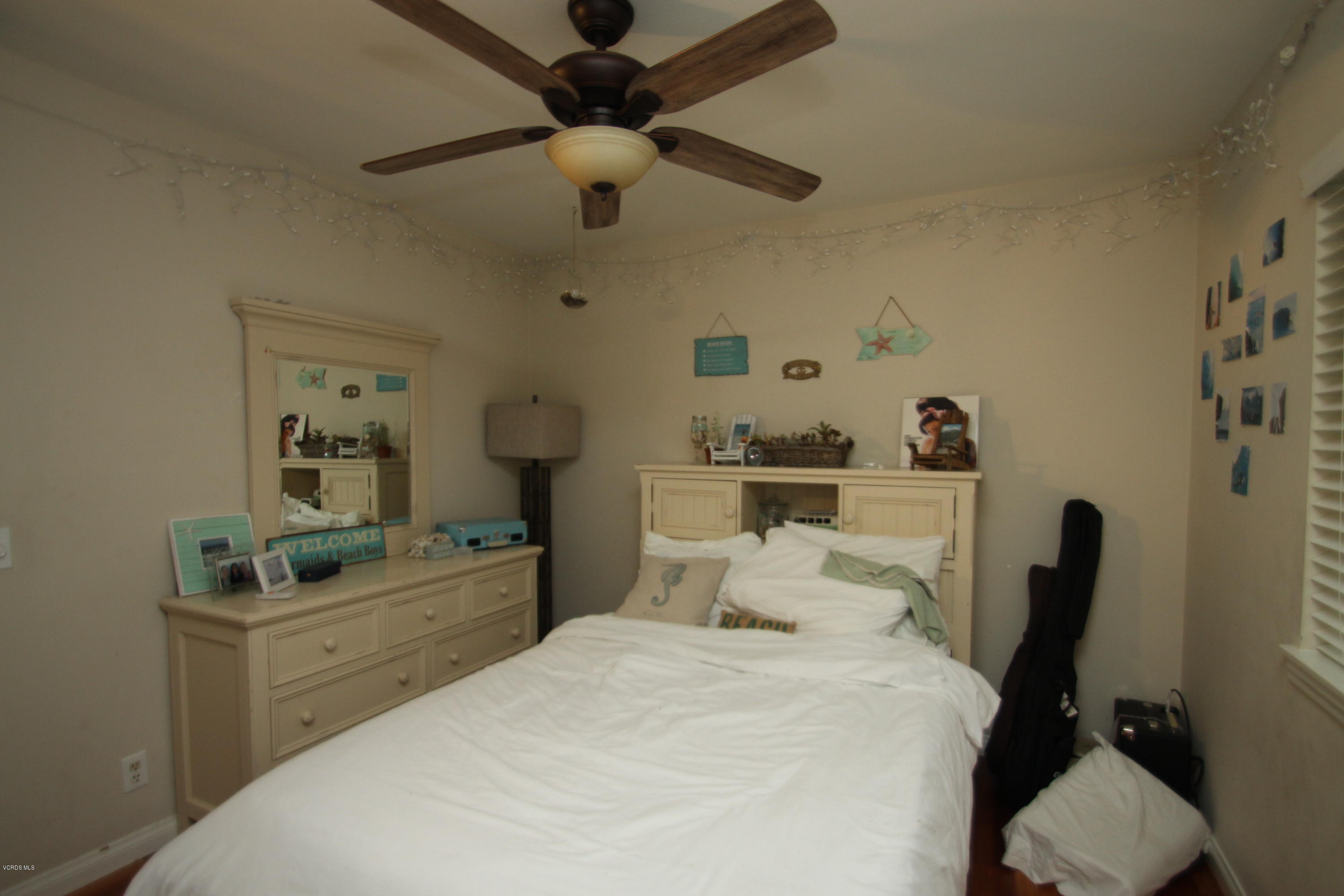 13638 Bear Valley Road Moorpark, CA 93021 - Photo 15 of 18 a bedroom with a bed and a desk