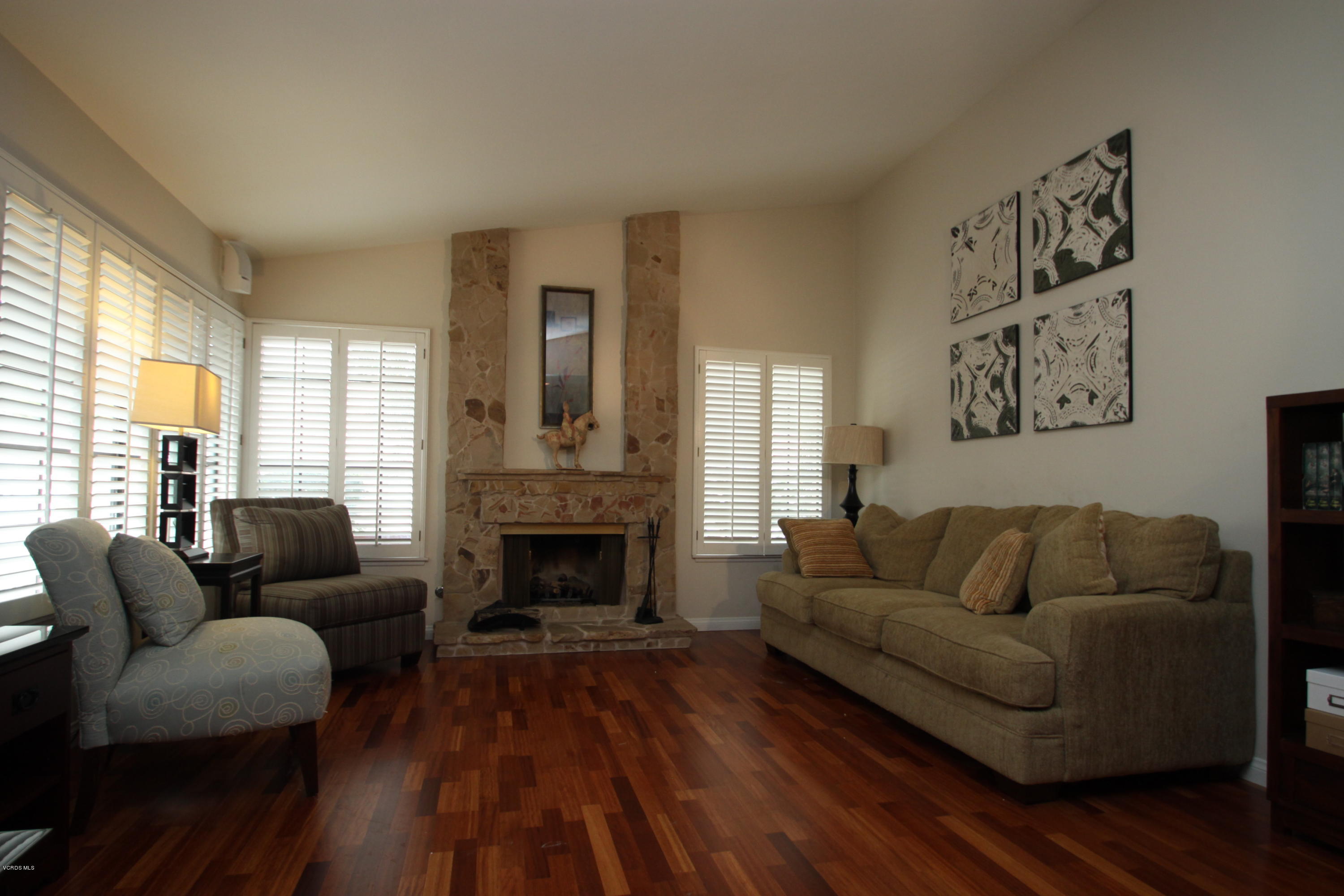 13638 Bear Valley Road Moorpark, CA 93021 - Photo 4 of 18 a living room with furniture and a fireplace