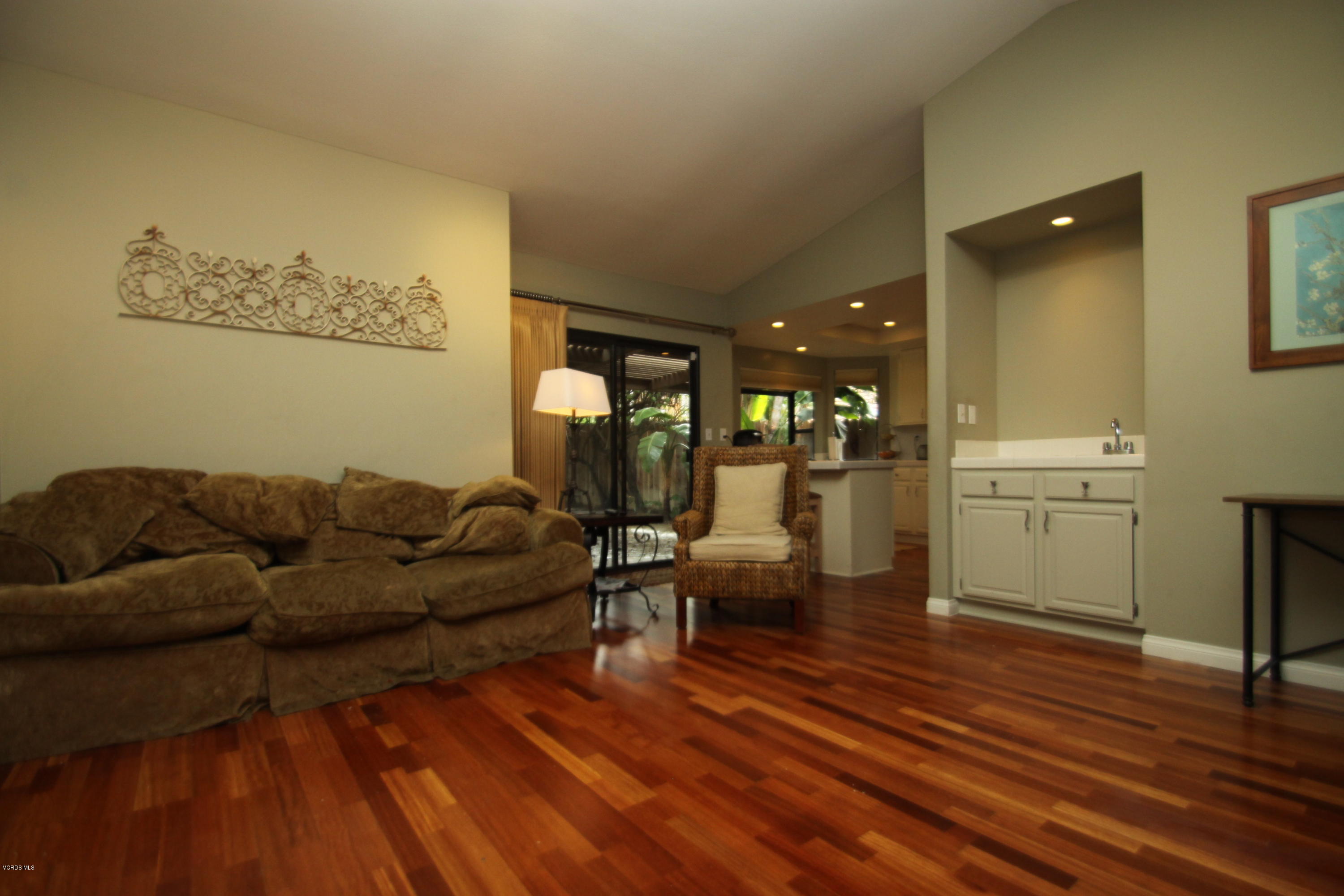 13638 Bear Valley Road Moorpark, CA 93021 - Photo 8 of 18 a living room with furniture and a wooden floor