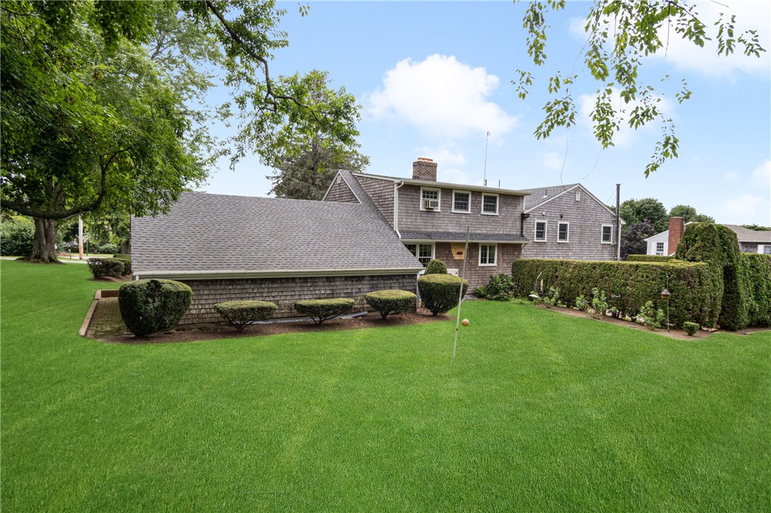 16 Circle Drive Middletown, RI 02842 - Photo 5 of 40 Back of house has arborvitae bordering private back deck.
