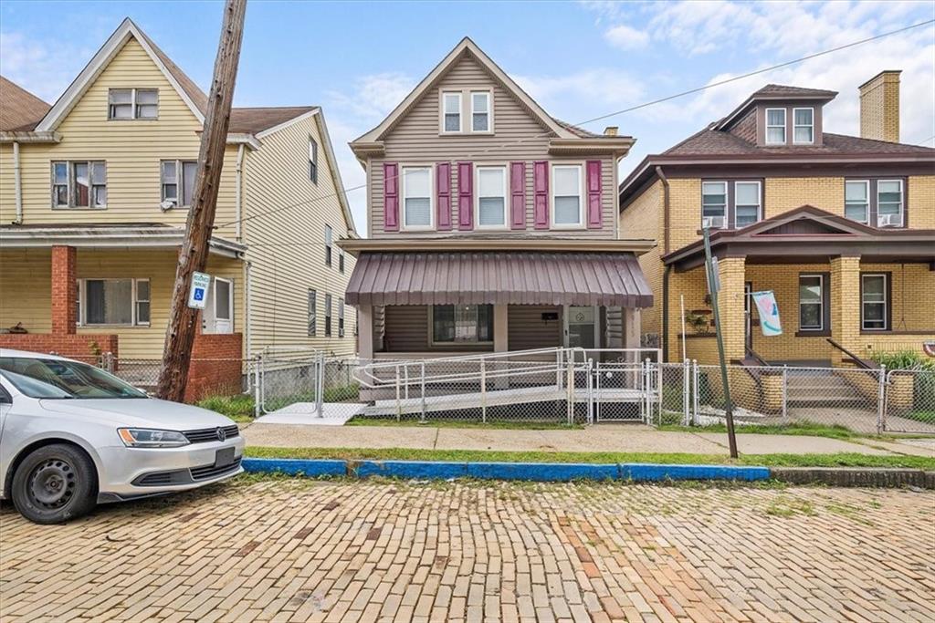 915 1st Street McKees Rocks, PA 15136 - Photo 1 of 25 a front view of a house with a yard