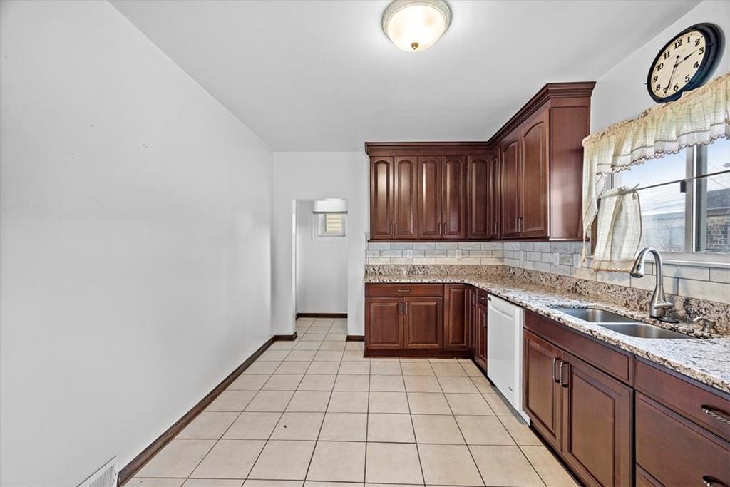 915 1st Street McKees Rocks, PA 15136 - Photo 12 of 25 a large kitchen with stainless steel appliances a cabinets and a sink