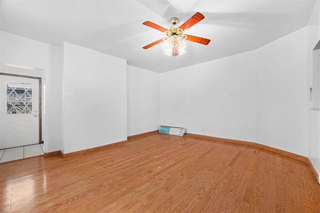 915 1st Street McKees Rocks, PA 15136 - Photo 17 of 25 a view of an empty room with wooden floor