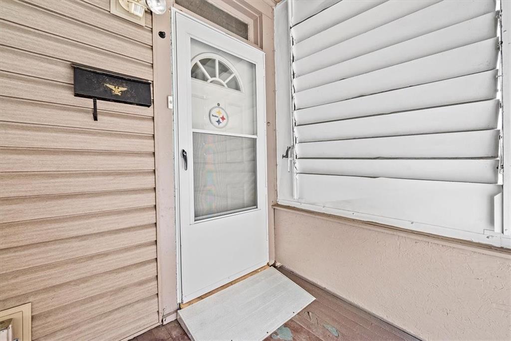 915 1st Street McKees Rocks, PA 15136 - Photo 3 of 25 a view of front door and wooden floor