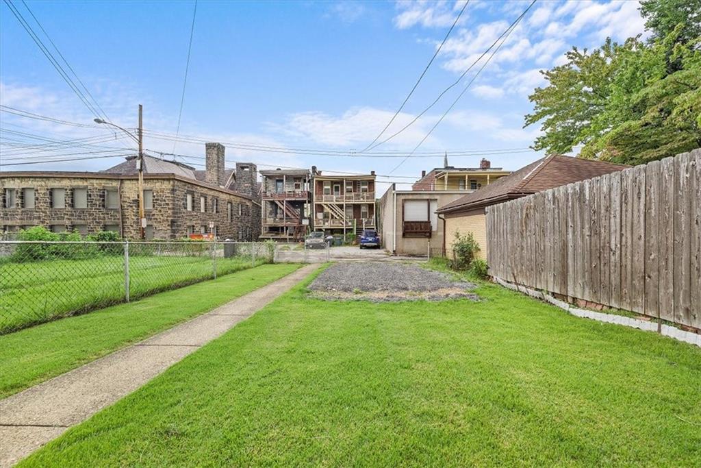915 1st Street McKees Rocks, PA 15136 - Photo 8 of 25 a view of a backyard with a garden