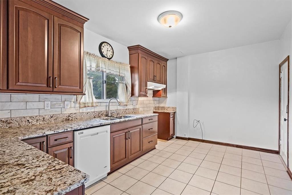 915 1st Street McKees Rocks, PA 15136 - Photo 10 of 25 a kitchen with a sink cabinets and window