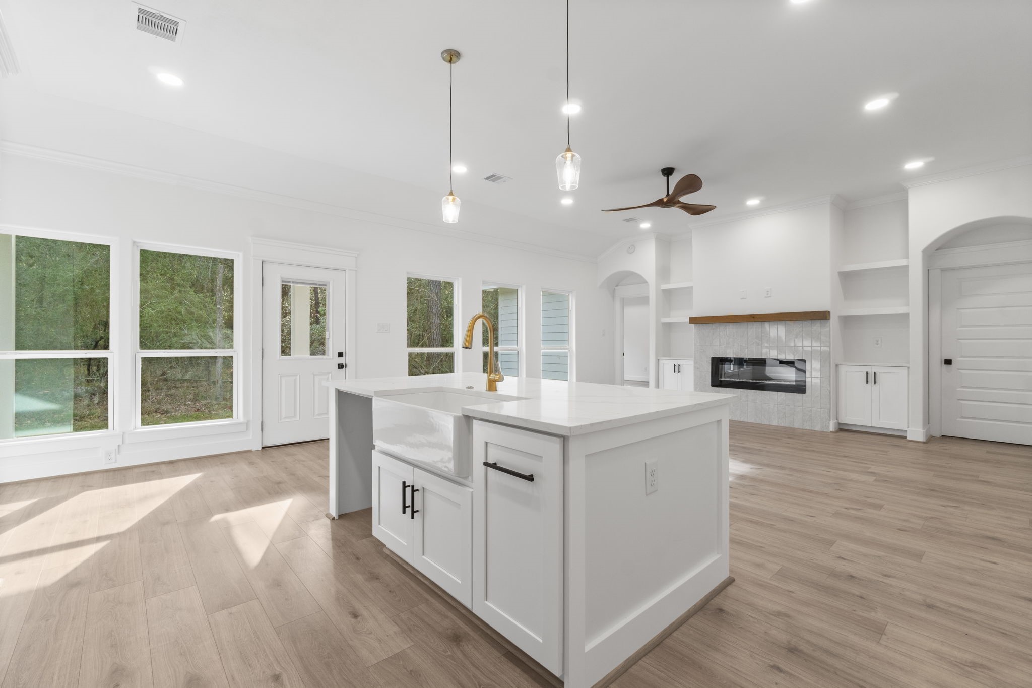 241 Clear Springs Trinity, TX 75862 - Photo 11 of 46 a large kitchen with kitchen island a large island wooden floor and stainless steel appliances