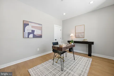 a workspace with furniture and wooden floor