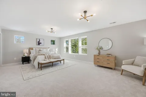 a bed room with furniture and a window