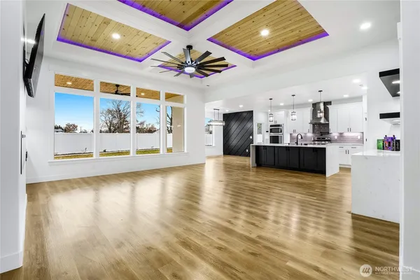 a view of a kitchen with a stove cabinets and a wooden floor