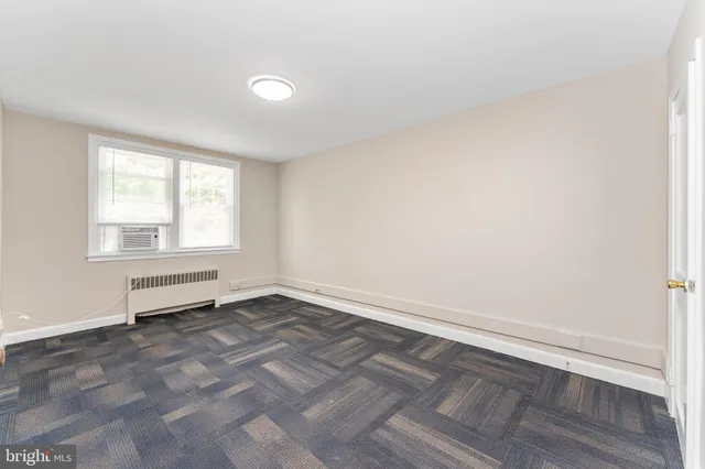 a view of an empty room and window