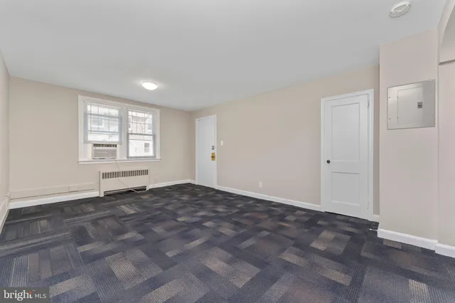 a view of an empty room and window