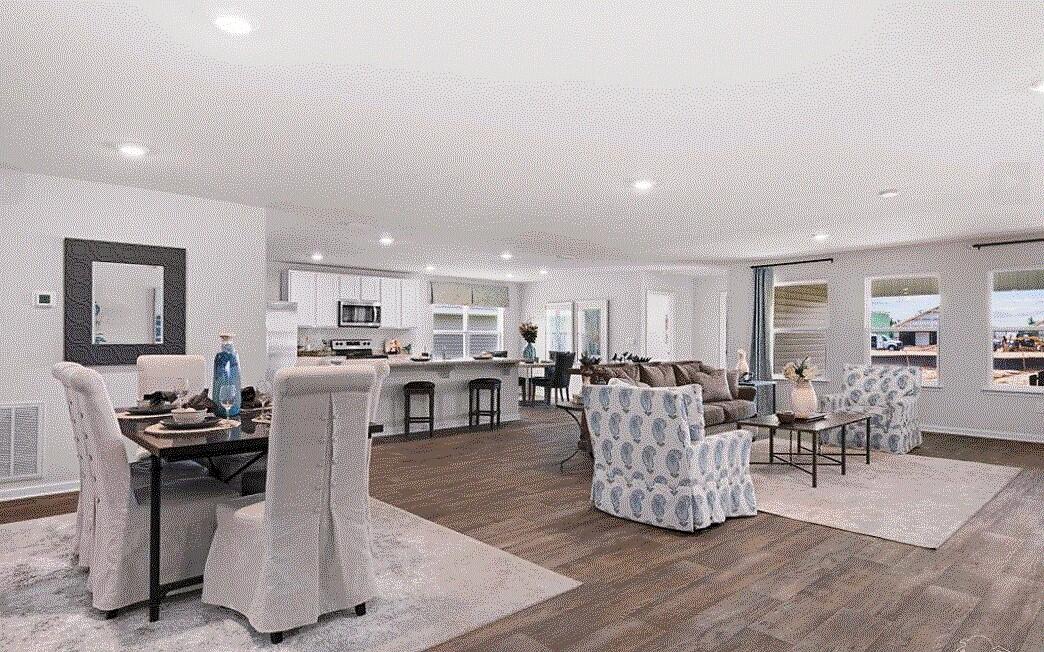 2535 Rutgers Road Crestview, FL 32536 - Photo 4 of 21 a living room with furniture a table and kitchen view