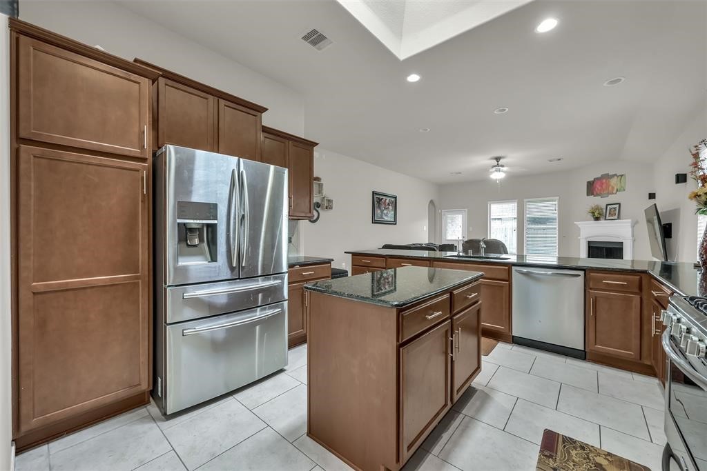 5415 Glenfield Spring Lane Spring, TX 77389 - Photo 12 of 16 a kitchen with a refrigerator sink and cabinets
