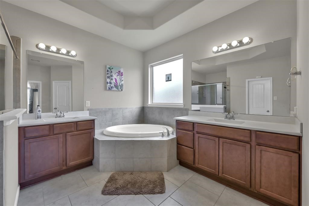 5415 Glenfield Spring Lane Spring, TX 77389 - Photo 14 of 16 a bathroom with a toilet sink and mirror